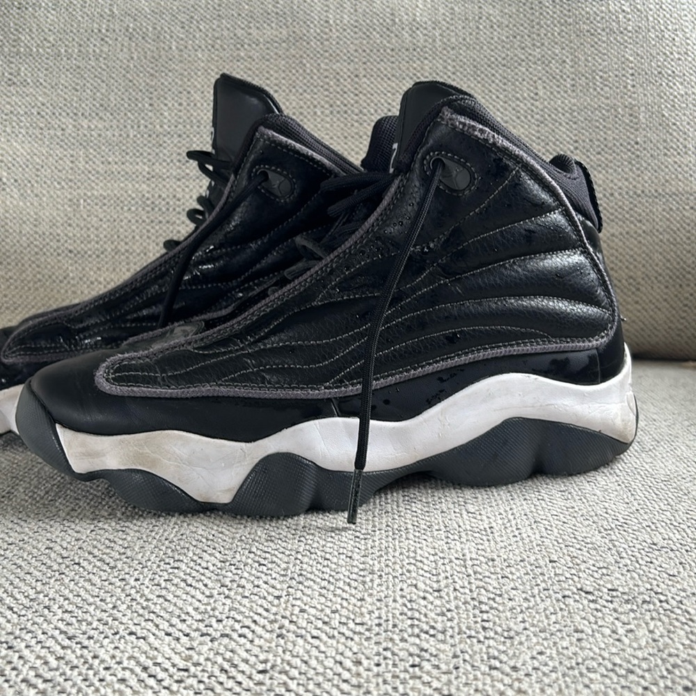 Kids black Jordan shoes